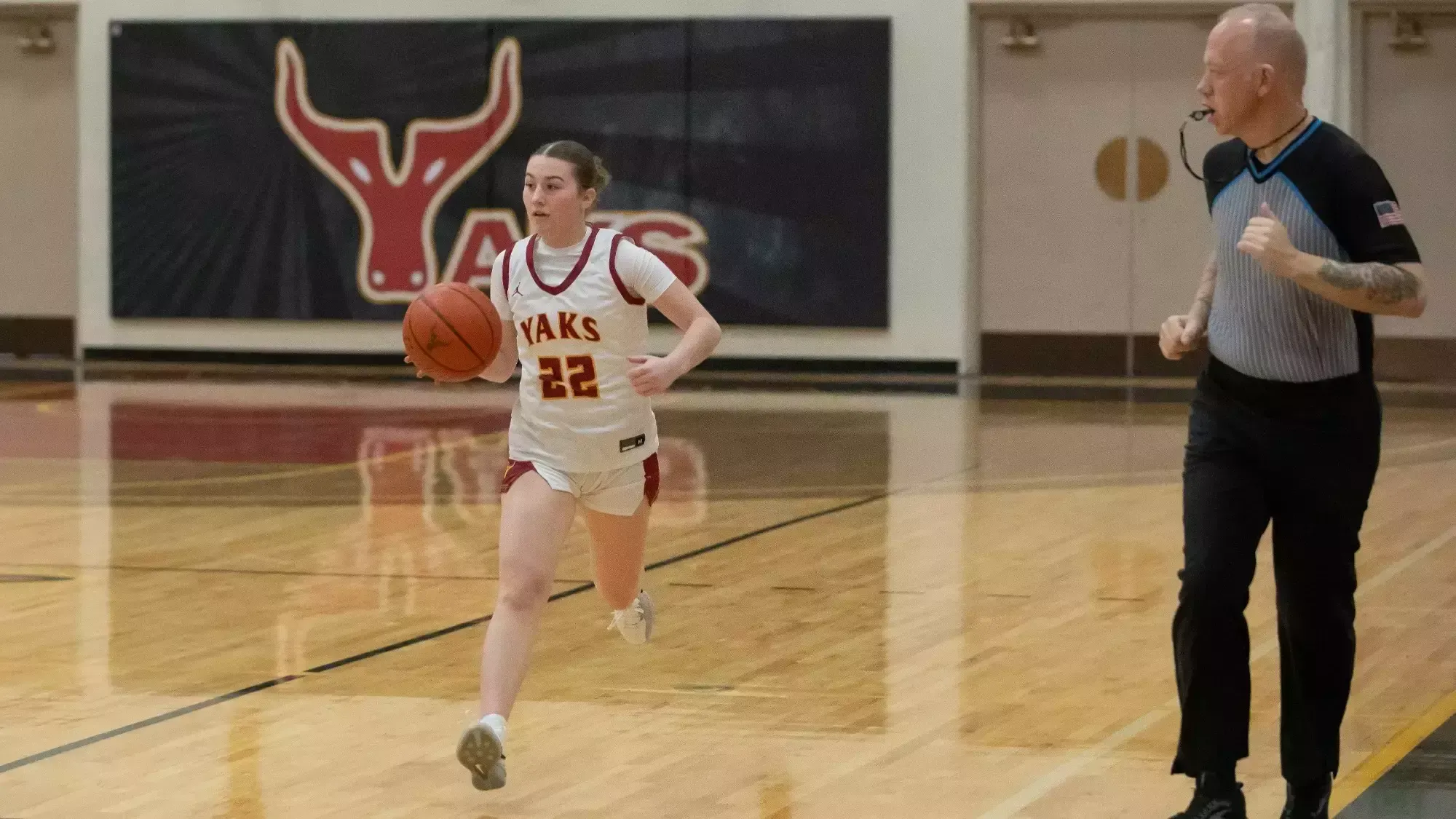 Avery Schumacher brings the ball up the floor