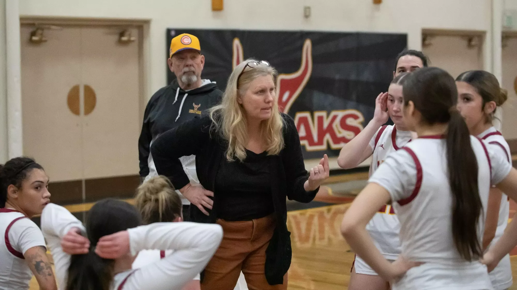 Coach Lanette Hooper manages the huddle