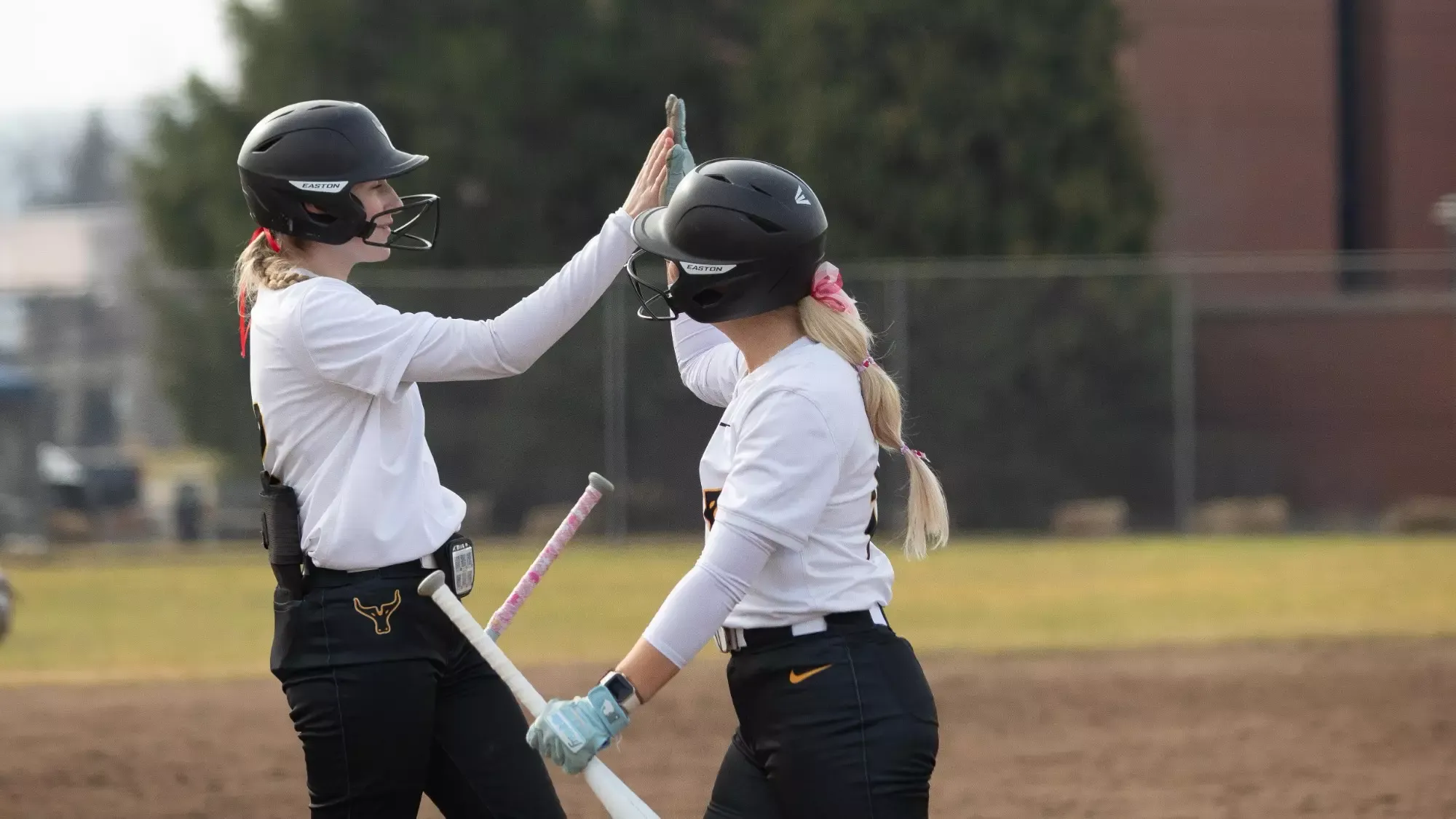 Ellie Urlacher and Cheyenne Justice share a high five