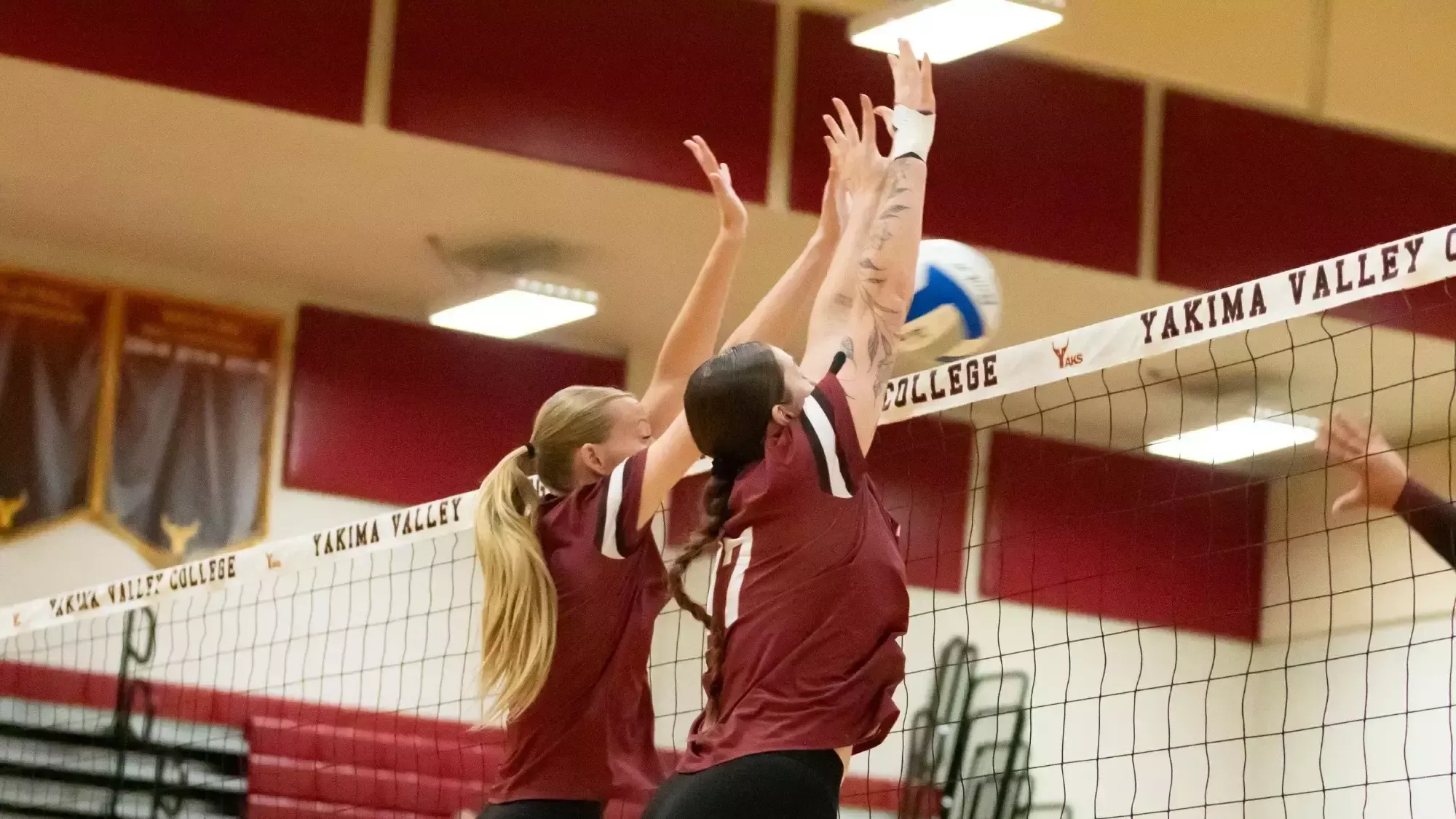 Lauren Jensen and Portlyn Stacy block a hit