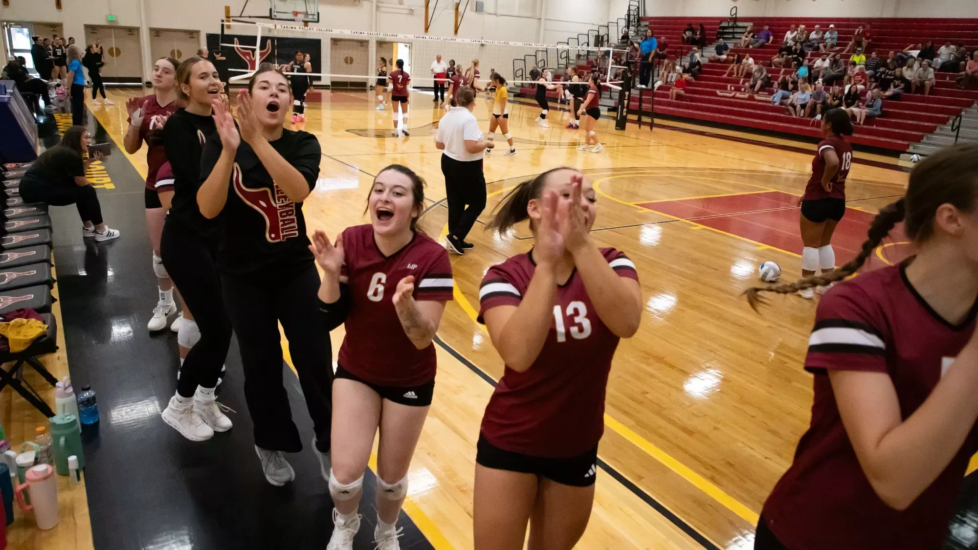 Presley Lindeman leads the bench in cheering